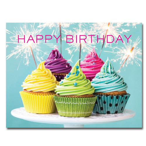 Sparklers Birthday Postcard shows photo of colorful cupcakes decorated with lighted sparklers and the words "Happy Birthday" in bright pink letters.