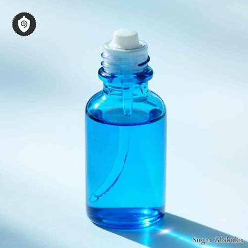 Cobaltum Fluoricum sugar spheres in compact orb form for energetic homeopathic (nonmedical) physical remedy presentation