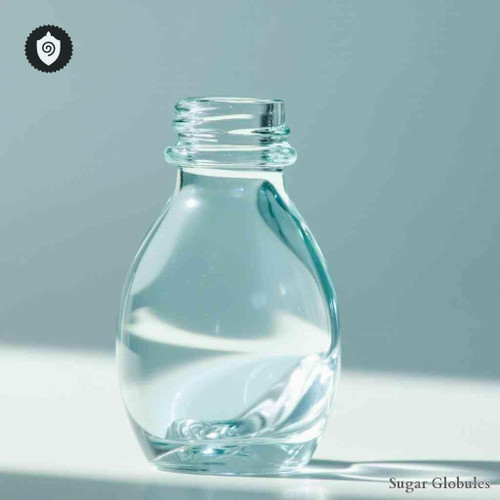 Kalium Gluconicum sugar spheres in compact orb format for energetic homeopathic (nonmedical) physical remedy presentation