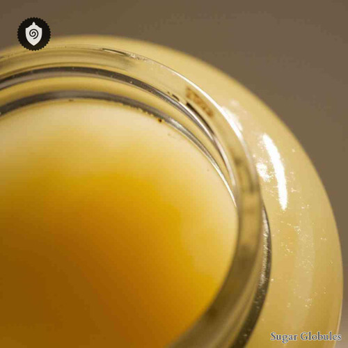 Lanolinum sugar spheres in precise pellet form for energetic homeopathic (nonmedical) solid presentation and organized storage