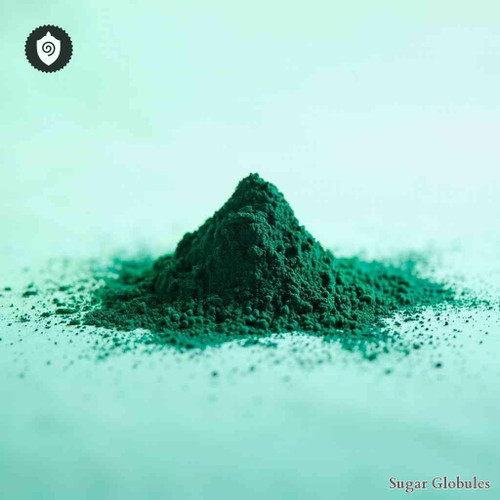 Spirulina sugar spheres in polished orb format for energetic homeopathic (nonmedical) physical product display and dry storage