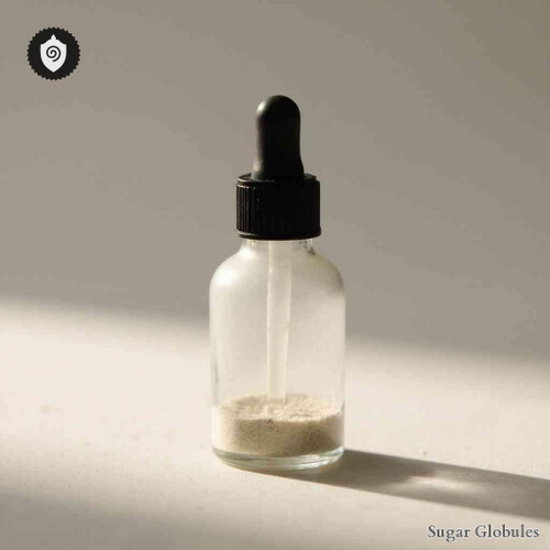 Syphilinum - Leusinum sugar spheres arranged in precise orb form for energetic homeopathic (nonmedical) dry storage and presentation