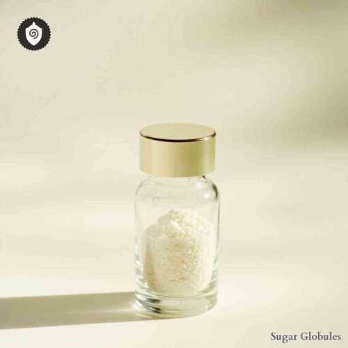 Venus Mercenaria Caro sugar orbs arranged in uniform sphere form for energetic homeopathic (nonmedical) remedy storage and distribution