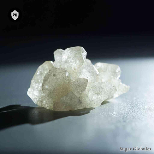 Ytterbium Fluoratum sugar granules in precise sphere format for energetic homeopathic (nonmedical) product presentation