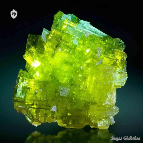 Autunite sugar granules in precise spherical form for energetic homeopathic (nonmedical) dry-form presentation and storage