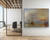 An immense, architectural-scale 82x60-inch horizontal landscape print of J.M.W. Turner's The Fighting Temeraire on a minimalist corporate corridor wall. The massive, non-reflective matte reproduction showcases the deep charcoal tones of the steam tugboat and the glowing sky without surface glare.