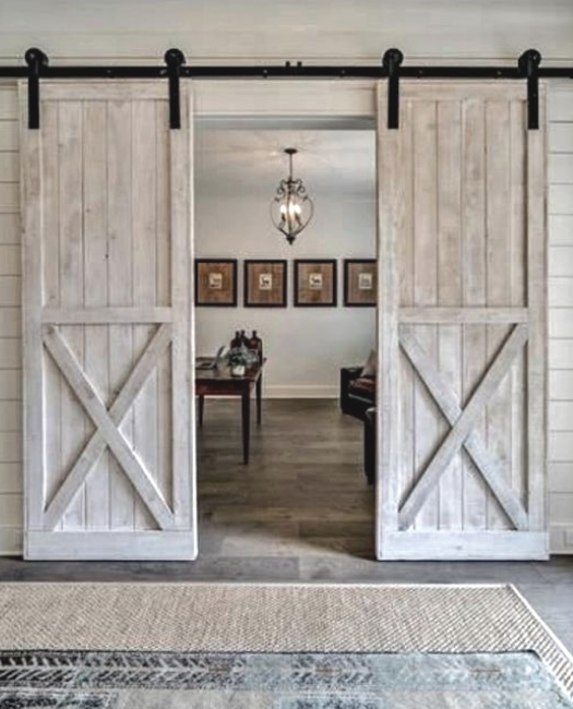 white washed double sliding barn door in our lake placid style