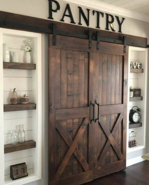 walnut stained closed lake placid double sliding barn doors to kitchen pantry