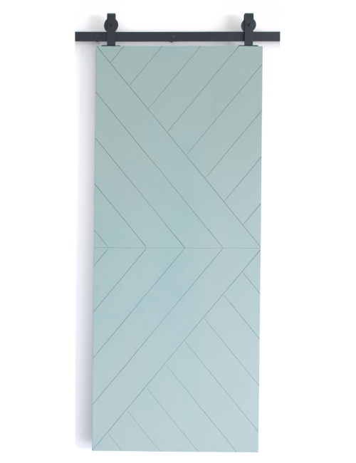 teal painted wood barn door with etched design