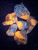 Hackmanite, feldspar, astrophyllite, etc; Tenebrescent UV reactive mineral specimen from Mont Saint-Hilaire, Quebec, Canada