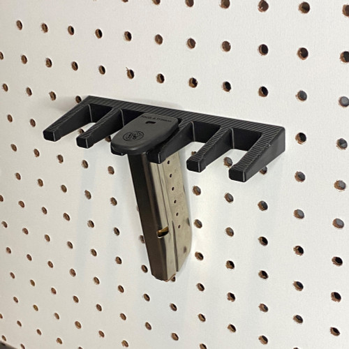 Organize your Canik magazines on a pegboard with this durable, easy-to-mount holder. Perfect for home defense or safe storage, it’s compatible with all Canik TP9 models and magazines, made in the USA with top-quality 3D prints.