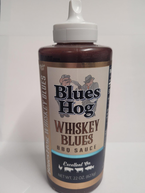 Bring bold, smoky-sweet flavor to your next cookout with Blues Hog Whiskey Blues BBQ Sauce - a gourmet barbecue sauce with smooth notes of cinnamon, apple, and toasty oak, finished with a whisper of smoke and real whiskey-inspired depth. This new standout from our Choice of Champions lineup is one of the best BBQ sauces for elevating steak, burgers, chicken, kabobs, and more.

We’ve taken the smooth traditional BBQ flavor you love and spiked it with a taste of whiskey to bring true, Western BBQ flavor to any meal. With the rich, complex profile of a top-tier bourbon glaze, it’s perfect for fans of bourbon BBQ sauce, whiskey sauce, and bold American classics like buffalo sauce or teriyaki sauce. Whether you're crafting an award-winning rack of ribs, finishing off meatloaf, or looking for the perfect dipping sauce for fries, this whiskey-forward bbq sauce delivers.