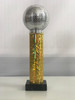 silver disco ball on gold column trophy