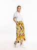 Model in Style X Lab Expression Skirt Yellow Print Side View made longer for tall women