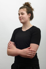 Tall woman wearing Redwood Clothing Ava SS Tee in Black front arms