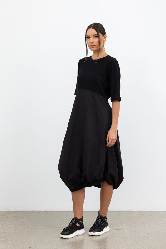Dynamic Drape Dress Black Front View. On Tall Model.
