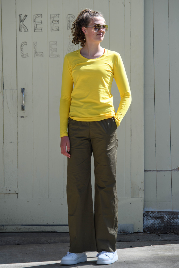 Tall woman in Redwood Clothing Ava Crew Top in Canary front view