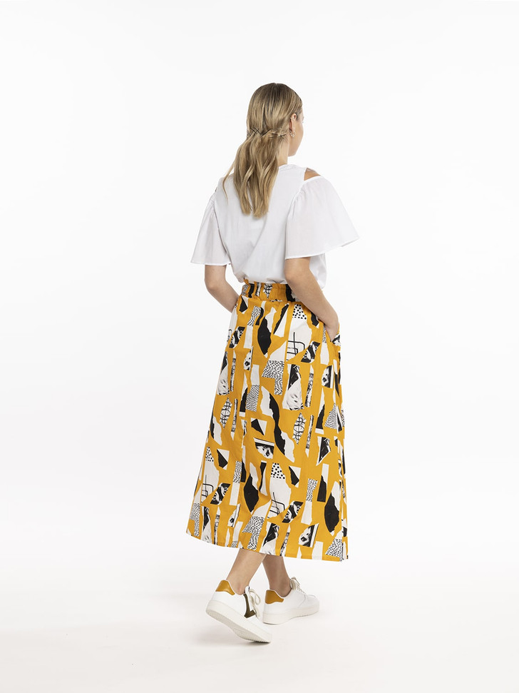 Model in Style X Lab Expression Skirt Yellow Print Back View made longer for tall women