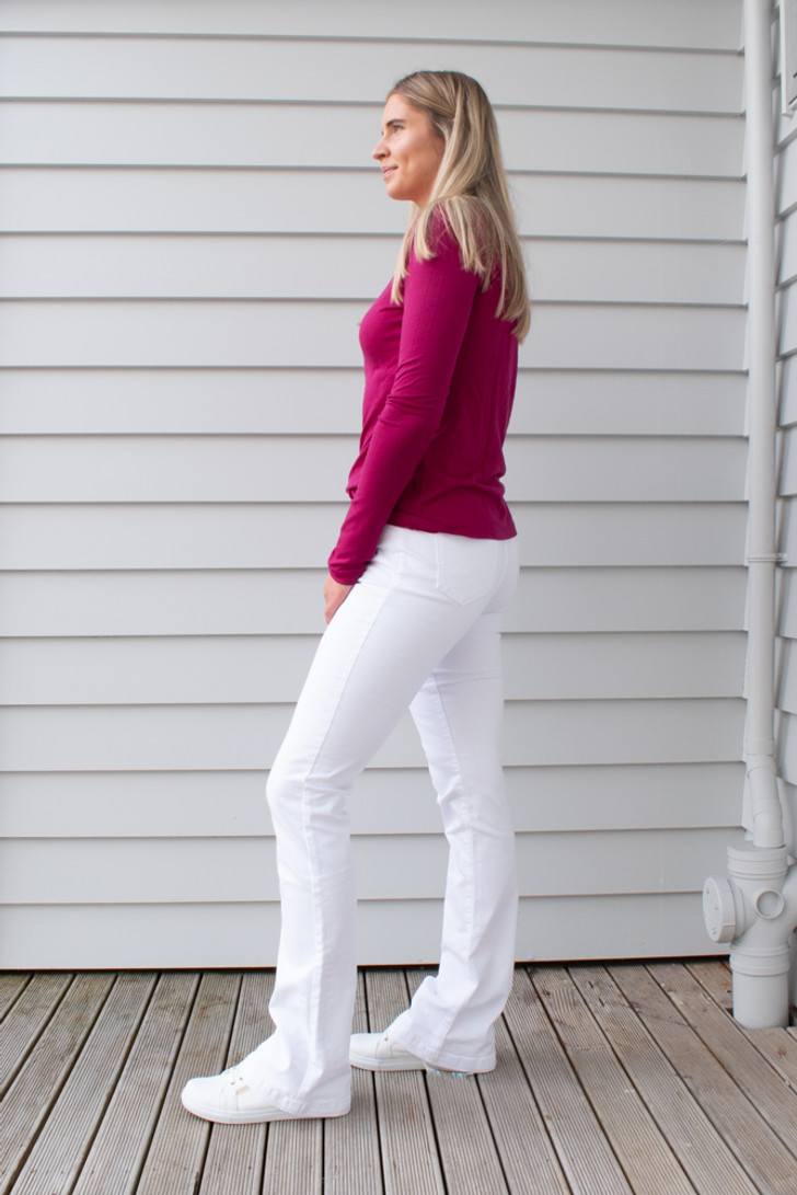 Tall woman wearing Fallon jeans in White by LTB Jeans. Sidet view