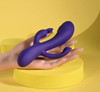 Selopa Triple Tickle held in a hand to show size and three-arm layout.