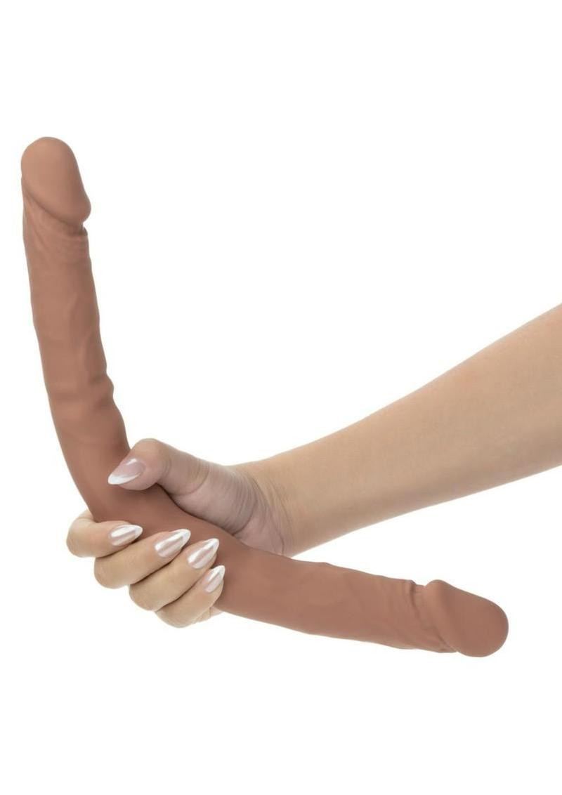 Side view of CalExotics Studs 16 inch dual-ended silicone dong showing full length and texture