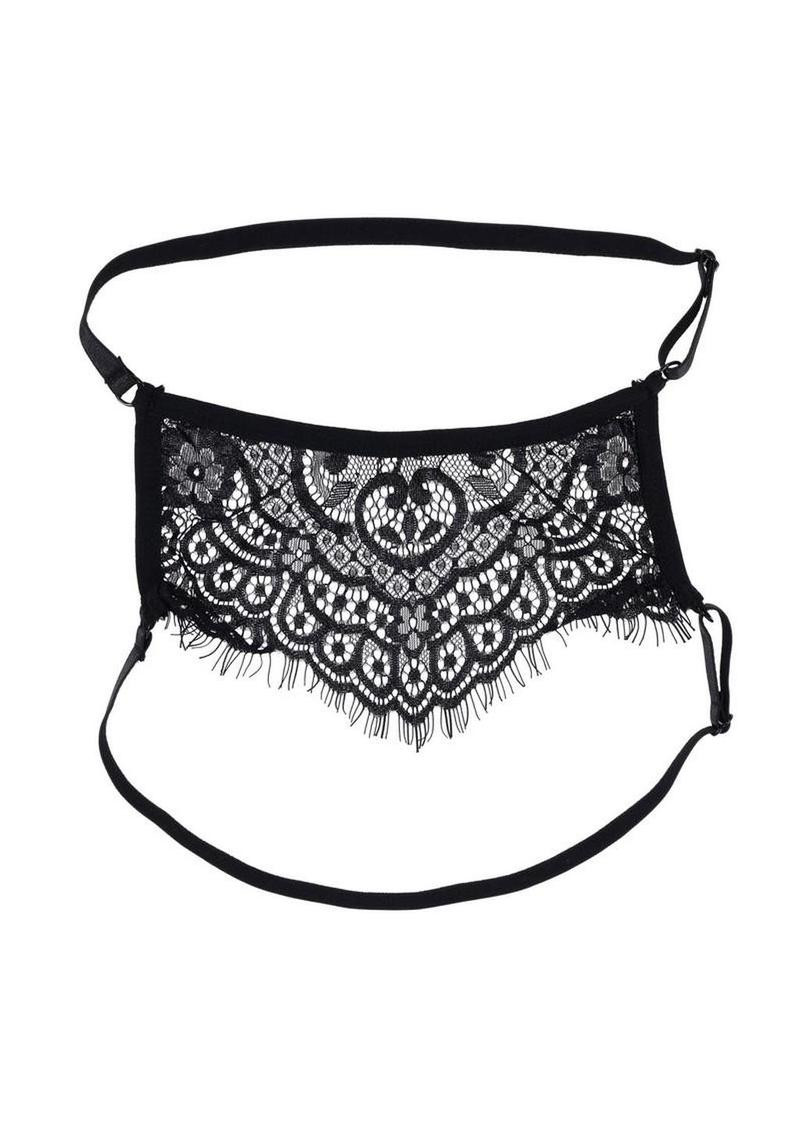 Veiled Vision lace blindfold laid flat, black floral panel facing forward with straps extended.