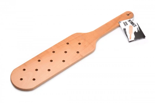 Strict Wood Paddle in solid beech wood showing its full classic design with aerodynamic holes for swift, powerful, and intense spanking pleasure