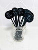 Black acrylic with white text drink stirrers.