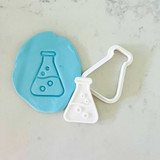Science flask cookie stamp with blue fondant impression