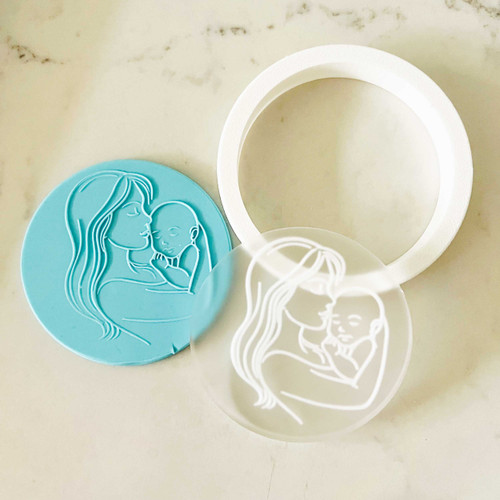 Mother holding baby fondant stamp with cutter
