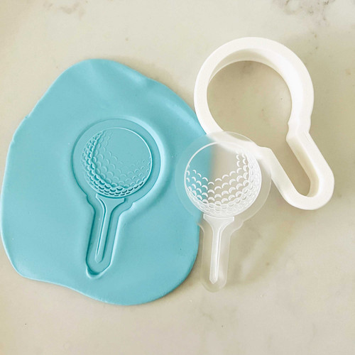 Golf Ball on Tee cookie stamp and cutter set shown with fondant imprint