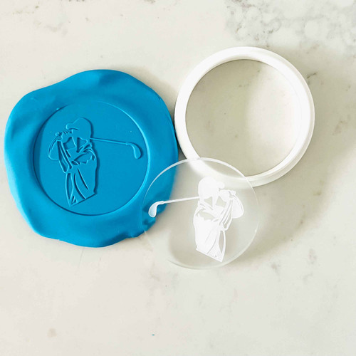 Embossed golf swing design pressed into blue fondant