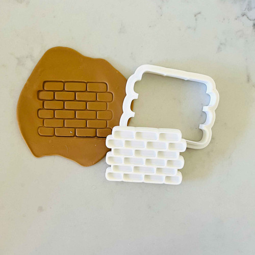 Brick wall cookie stamp with fondant design