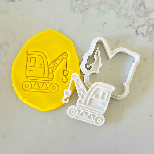 Debossed excavator crane cookie stamp in yellow fondant