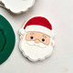 Debossed Santa fondant topper showing beard and hat detail