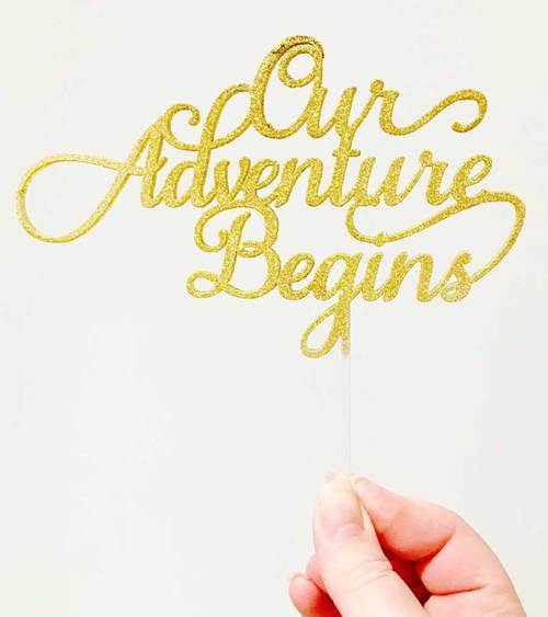 acrylic-wedding-cake-topper-our-adventure-begins.jpg