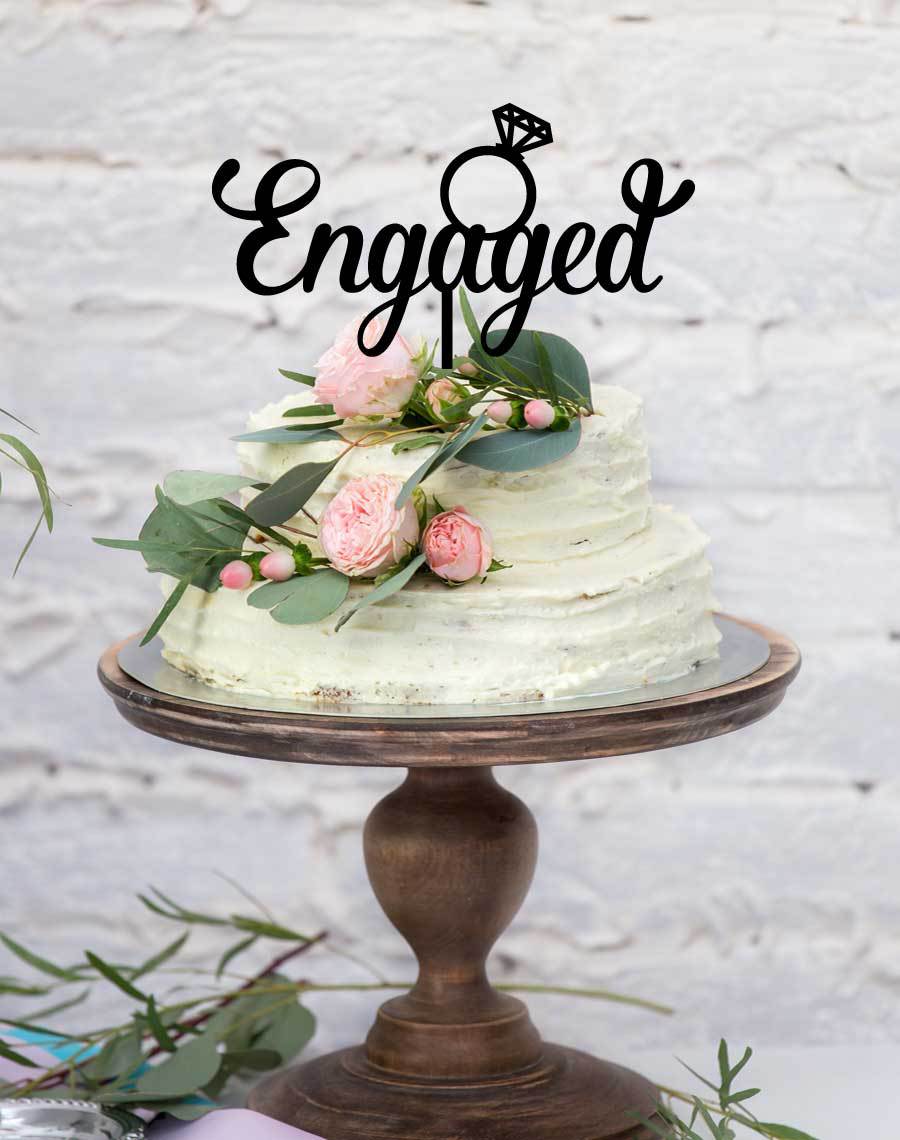 wedding-cake-topper-engaged-with-ring.jpg